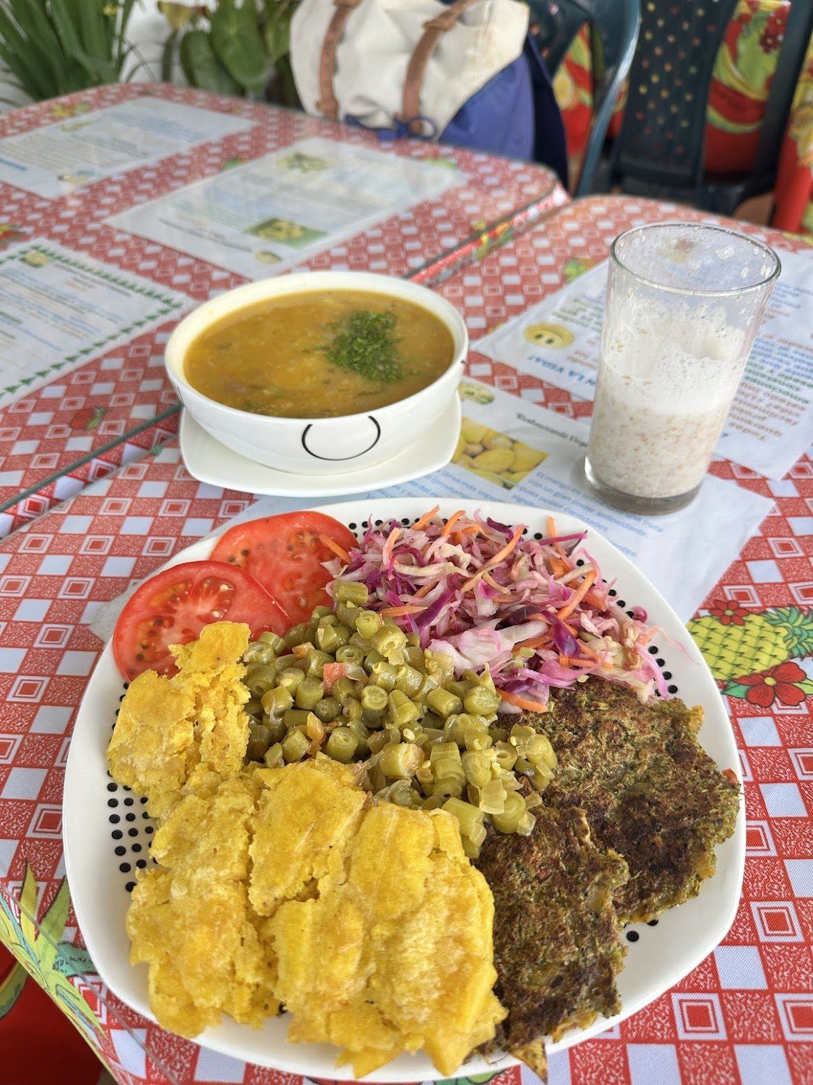 A plate of rice, plantain and salad