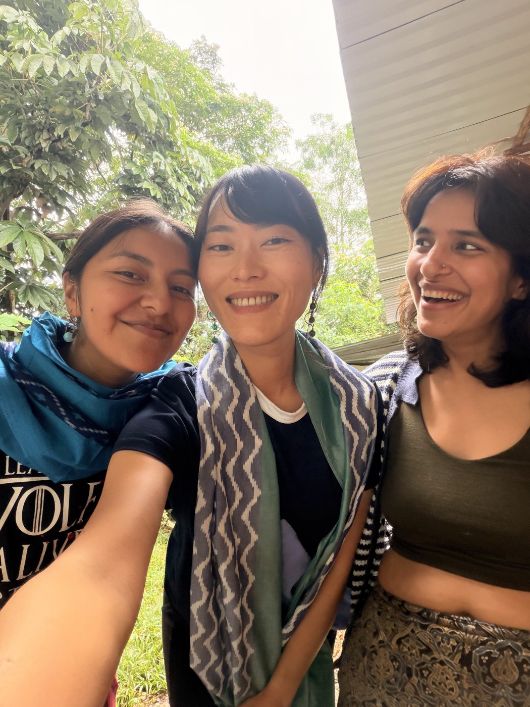 Min smiling with two friends
